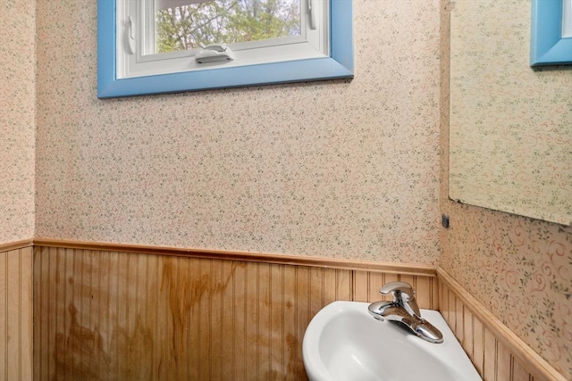 35 Chapin Rd, Holden, MA 01520 - bathroom featuring wallpapered walls, a wainscoted wall, and a sink