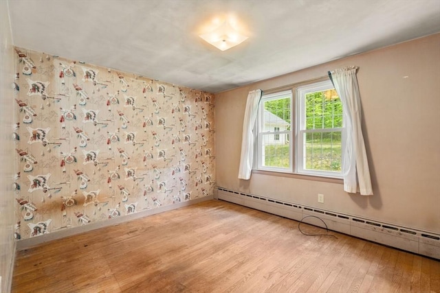35 Chapin Rd, Holden, MA 01520 - spare room with baseboard heating, wood finished floors, and baseboards