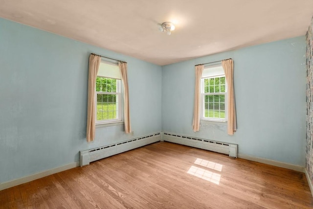 35 Chapin Rd, Holden, MA 01520 - empty room featuring wood finished floors, plenty of natural light, and baseboard heating
