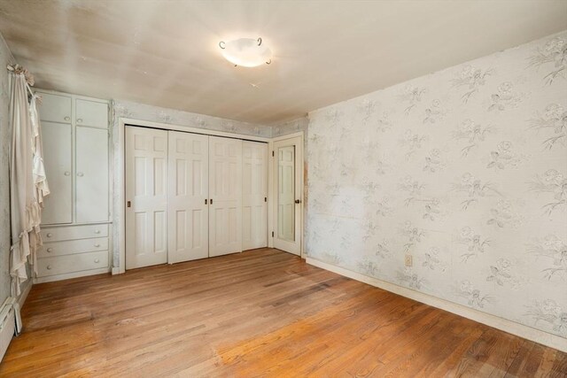 35 Chapin Rd, Holden, MA 01520 - unfurnished bedroom featuring light wood-style flooring, wallpapered walls, and baseboards