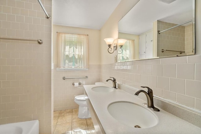 35 Chapin Rd, Holden, MA 01520 - bathroom with tile walls, toilet, shower / bath combination, and double vanity