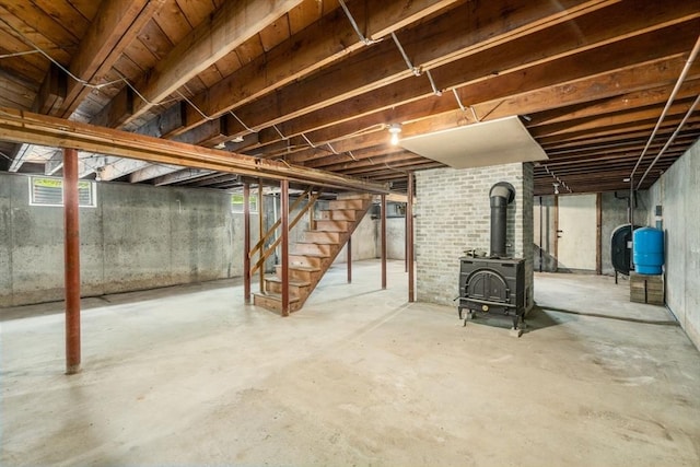 35 Chapin Rd, Holden, MA 01520 - basement featuring stairway, a water pressure tank, and a wood stove
