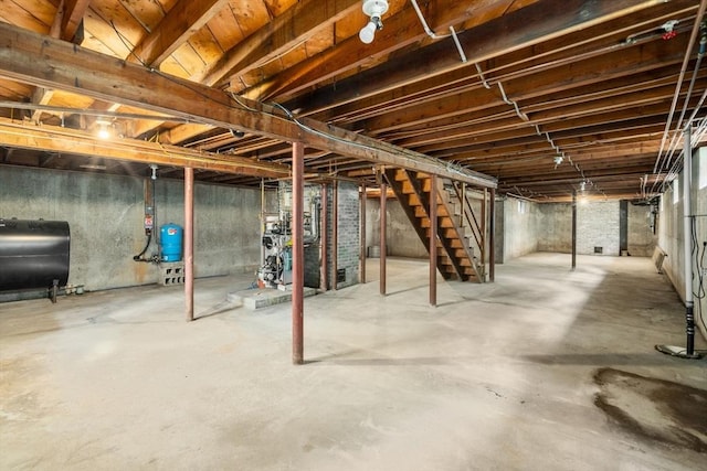 35 Chapin Rd, Holden, MA 01520 - unfinished basement with heating fuel, stairs, a water pressure tank, and a heating unit