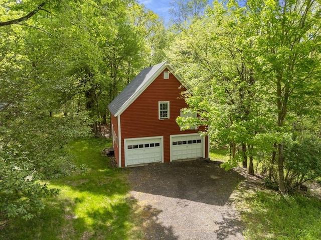 35 Chapin Rd, Holden, MA 01520 - garage with a garage and a view of trees