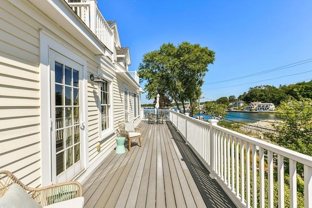 wooden deck with a water view