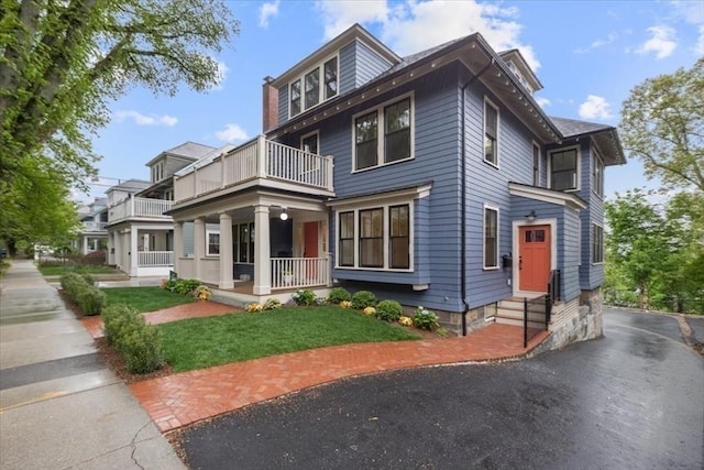 197 Winchester St Unit 197, Brookline, MA 02446 - american foursquare style home featuring a balcony and covered porch