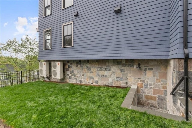 197 Winchester St Unit 197, Brookline, MA 02446 - view of side of home featuring stone siding and ac unit