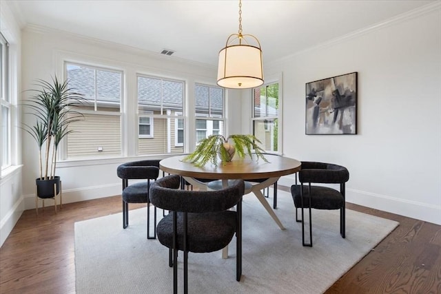 197 Winchester St Unit 197, Brookline, MA 02446 - dining room featuring dark wood-type flooring, crown molding, and baseboards