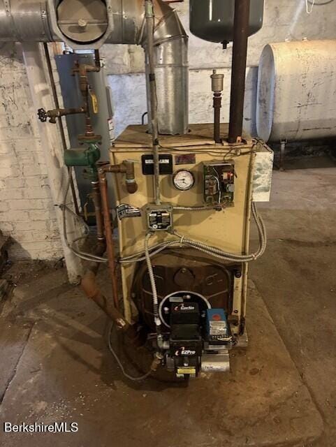 21 River St, North Adams, MA 01247 - utility room featuring oil tank and a heating unit