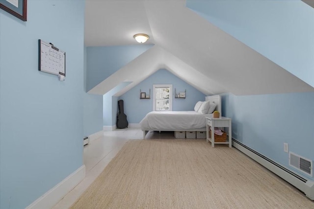 bedroom with visible vents, baseboard heating, vaulted ceiling, baseboards, and a baseboard radiator