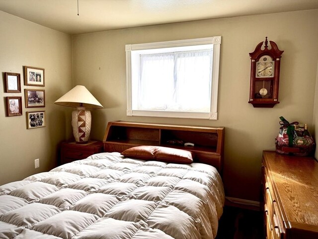 bedroom featuring baseboards