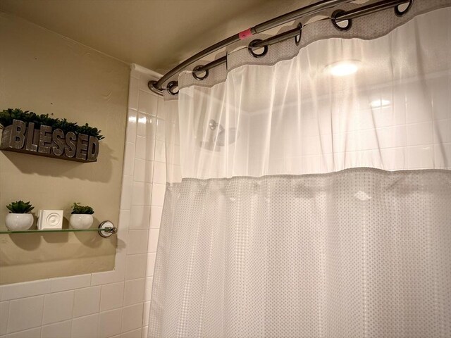 bathroom with curtained shower