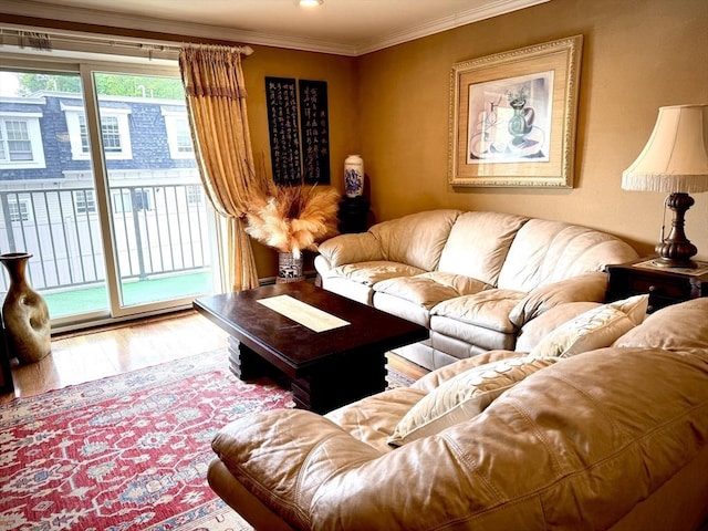 living room with wood finished floors and crown molding