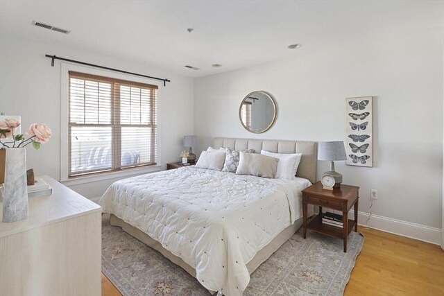 1306 Columbia Rd Unit 5C, Boston, MA 02127 - bedroom featuring visible vents, baseboards, and light wood-style floors