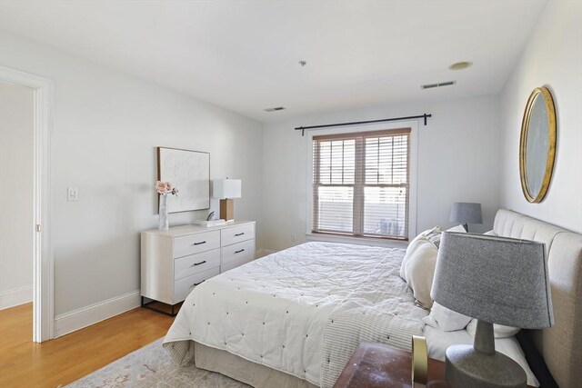 1306 Columbia Rd Unit 5C, Boston, MA 02127 - bedroom featuring baseboards, visible vents, and light wood-type flooring