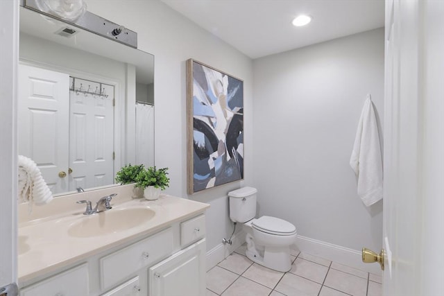 1306 Columbia Rd Unit 5C, Boston, MA 02127 - full bathroom featuring tile patterned flooring, visible vents, baseboards, toilet, and vanity