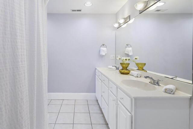 1306 Columbia Rd Unit 5C, Boston, MA 02127 - bathroom with tile patterned floors, visible vents, vanity, and baseboards