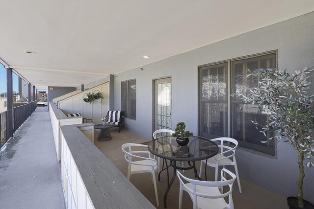 1306 Columbia Rd Unit 5C, Boston, MA 02127 - view of patio featuring a balcony and outdoor dining area