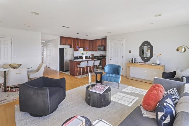 1306 Columbia Rd Unit 5C, Boston, MA 02127 - living room featuring recessed lighting, visible vents, and light wood-style flooring