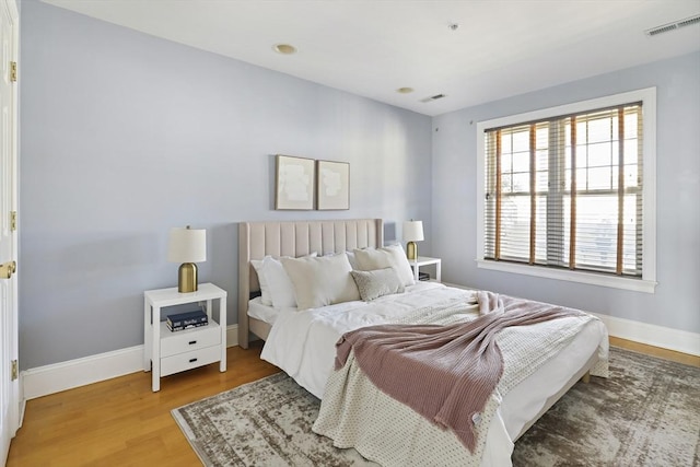 1306 Columbia Rd Unit 5C, Boston, MA 02127 - bedroom with visible vents, wood finished floors, and baseboards