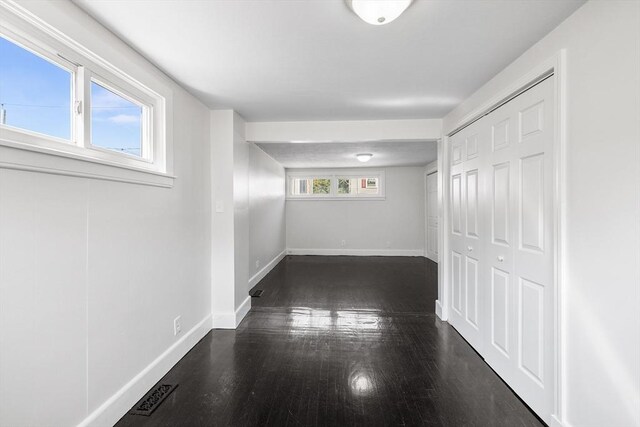 kitchen with light hardwood / wood-style flooring, pendant lighting, stainless steel refrigerator, and a center island