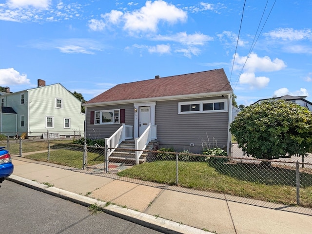 view of front of home featuring a front lawn