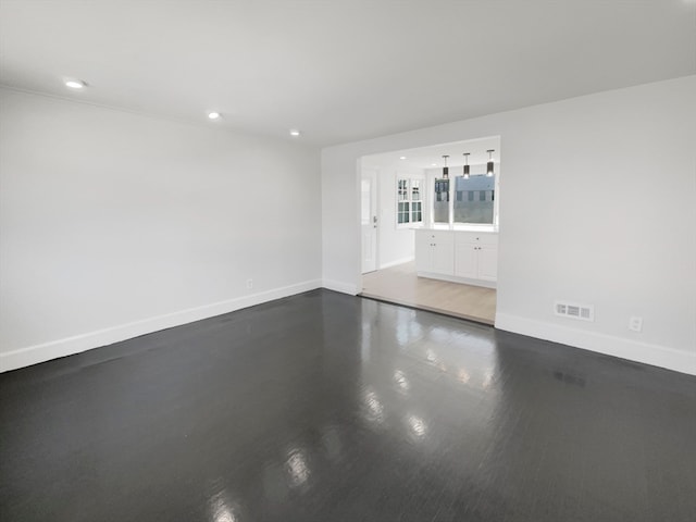 empty room featuring hardwood / wood-style flooring