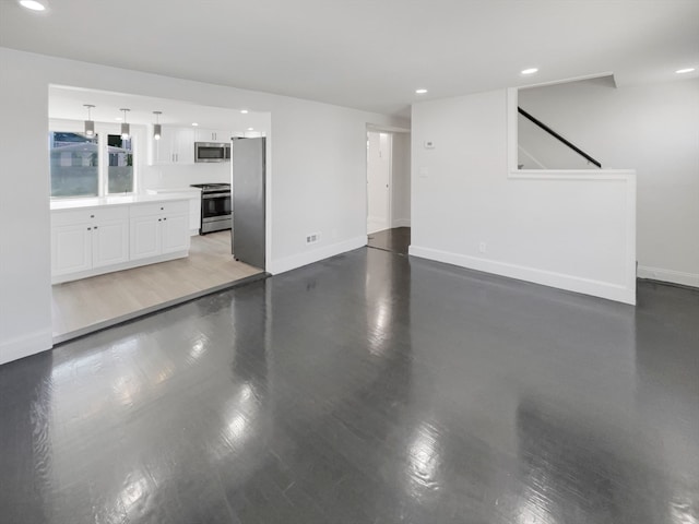 unfurnished living room with wood-type flooring