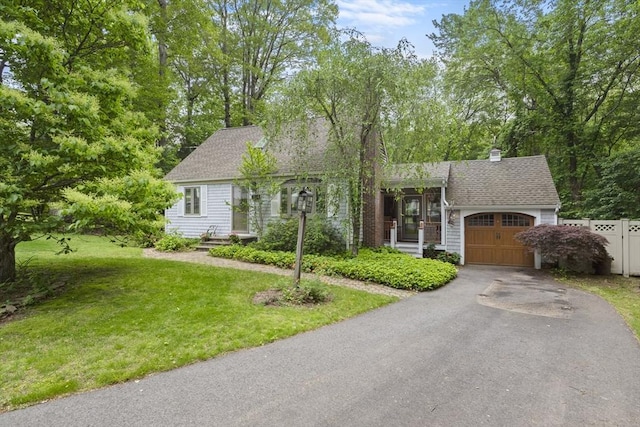 2 Rich Rd, Holliston, MA 01746 - view of front facade with an attached garage, driveway, roof with shingles, and a chimney