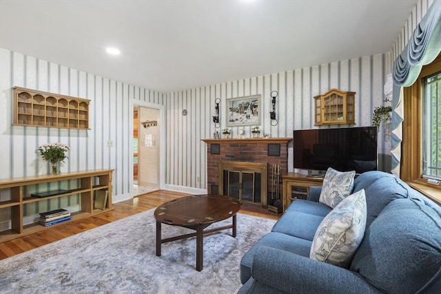2 Rich Rd, Holliston, MA 01746 - living area with wood finished floors, wallpapered walls, and a fireplace