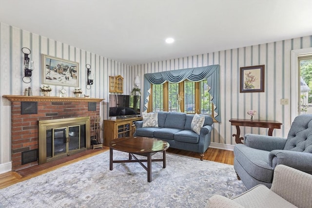 2 Rich Rd, Holliston, MA 01746 - living room featuring wallpapered walls, wood finished floors, and a brick fireplace