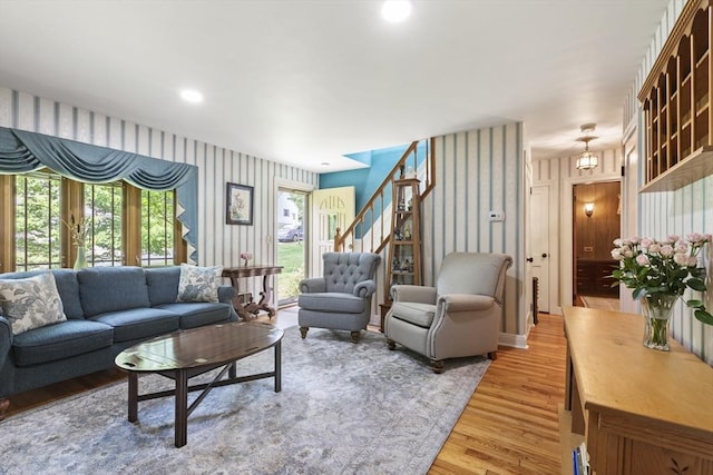 2 Rich Rd, Holliston, MA 01746 - living room with wallpapered walls, light wood-style floors, and stairs