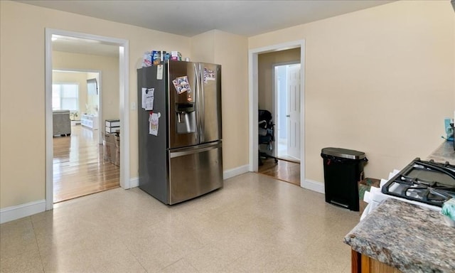 39-41 Arlington St, Methuen, MA 01844 - kitchen featuring stainless steel fridge with ice dispenser, baseboards, and light flooring