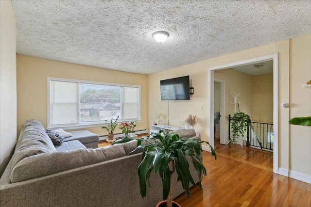 39-41 Arlington St, Methuen, MA 01844 - living room with light wood finished floors and a textured ceiling