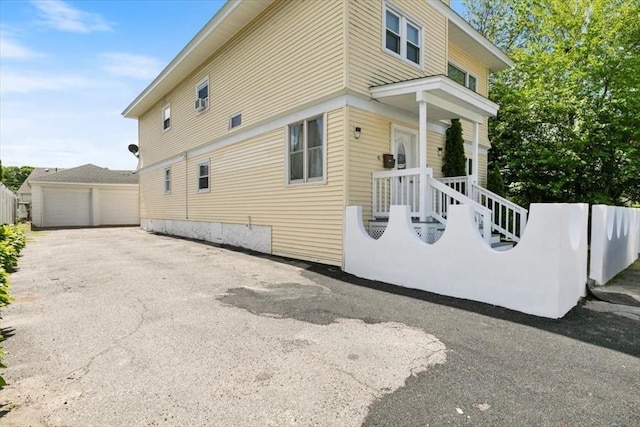 39-41 Arlington St, Methuen, MA 01844 - view of side of home featuring a detached garage and an outbuilding