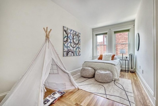 68 Parkman St Unit 3, Brookline, MA 02446 - bedroom with light wood finished floors and baseboards
