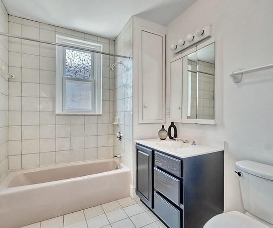 68 Parkman St Unit 3, Brookline, MA 02446 - bathroom with vanity, shower / bath combination, and tile patterned flooring