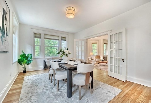 68 Parkman St Unit 3, Brookline, MA 02446 - dining space with light wood-type flooring and french doors