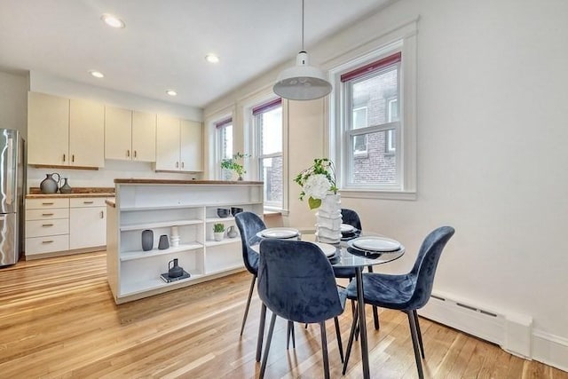 68 Parkman St Unit 3, Brookline, MA 02446 - dining area featuring light wood finished floors, recessed lighting, and baseboard heating