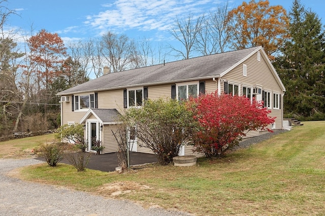 view of property exterior featuring a yard