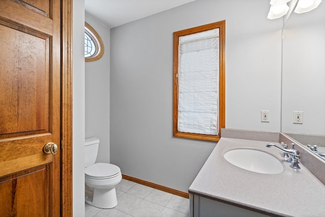 bathroom featuring tile floors, toilet, and vanity