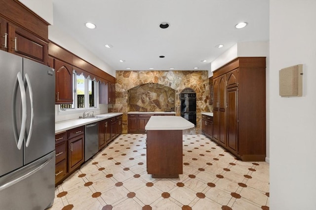 21 Wildewood Dr, Lynnfield, MA 01940 - kitchen with a kitchen island, recessed lighting, a sink, light countertops, and stainless steel appliances