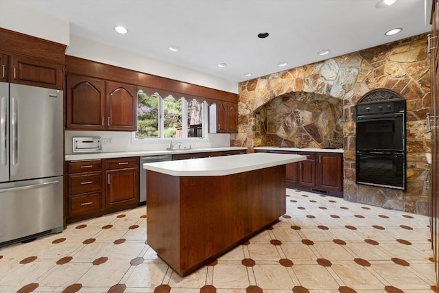 21 Wildewood Dr, Lynnfield, MA 01940 - kitchen with recessed lighting, a center island, light countertops, appliances with stainless steel finishes, and a sink