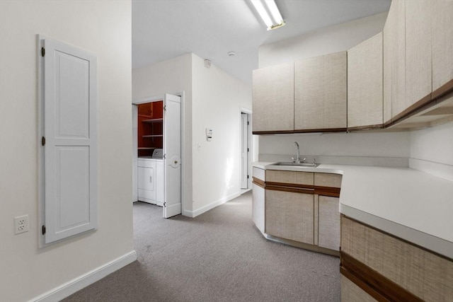21 Wildewood Dr, Lynnfield, MA 01940 - kitchen with carpet, light countertops, a sink, baseboards, and washer and clothes dryer
