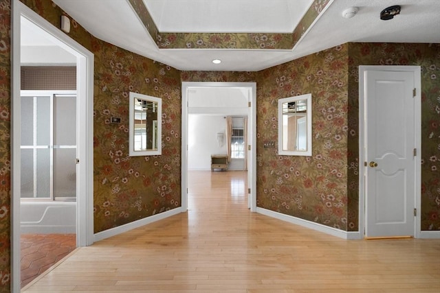 21 Wildewood Dr, Lynnfield, MA 01940 - hallway featuring wallpapered walls, light wood finished floors, and baseboards