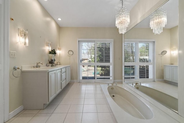 21 Wildewood Dr, Lynnfield, MA 01940 - full bathroom with baseboards, double vanity, an inviting chandelier, a bath, and a sink