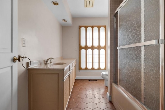 21 Wildewood Dr, Lynnfield, MA 01940 - full bathroom with vanity, tile patterned flooring, visible vents, toilet, and baseboards