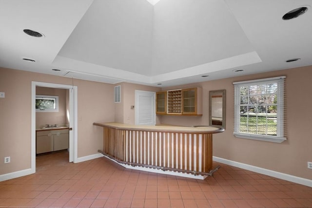 21 Wildewood Dr, Lynnfield, MA 01940 - bar with a tray ceiling, baseboards, and bar