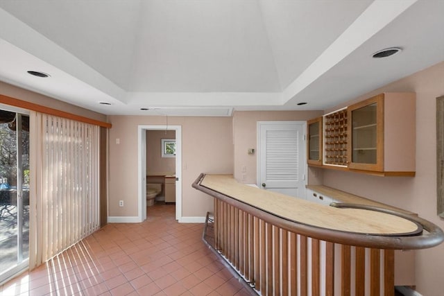 21 Wildewood Dr, Lynnfield, MA 01940 - bar featuring plenty of natural light, light tile patterned floors, baseboards, and indoor bar