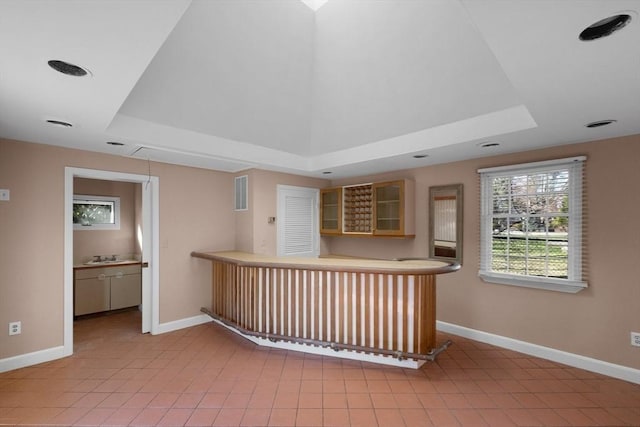 21 Wildewood Dr, Lynnfield, MA 01940 - bar featuring bar, a tray ceiling, and baseboards